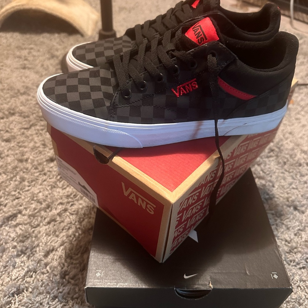 Vans Black and Red Checkerboard Sneakers never worn. Comes with box.